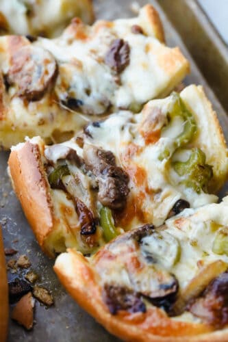 Philly Cheese Steak Cheesy Bread with just a few simple ingredients is the taste of Philly for a crowd! It comes together in just minutes with major flavor in each bite!