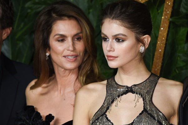 Kaia Gerber Poses Up A Storm Backstage In Black Latex Bra At Saint Laurent Show